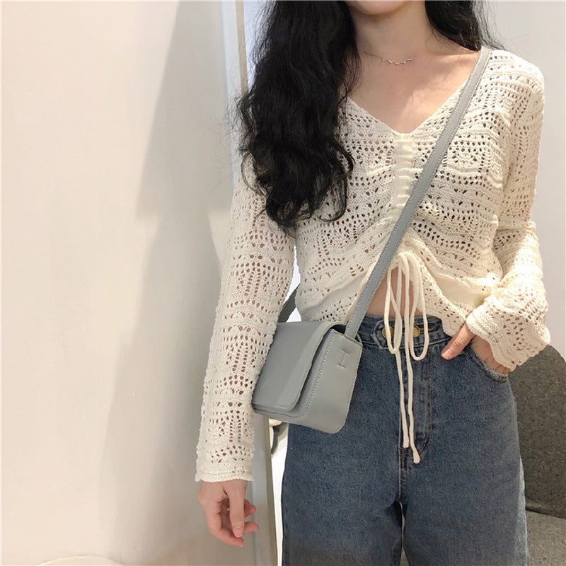 Pull en tricot pour femmes avec un motif de trous décoratif et un cordon réglable Chic und Stil
