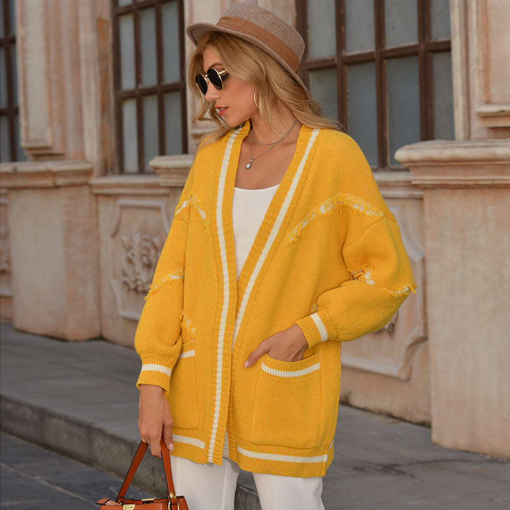 Cardigan en tricot pour dames avec des franges tendance et des poches pratiques Chic und Stil