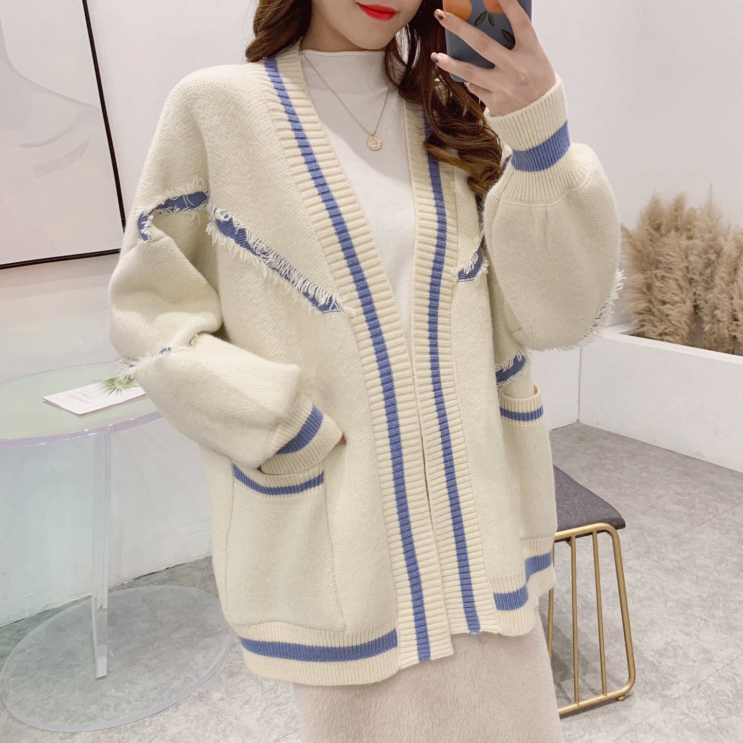 Cardigan en tricot pour dames avec des franges tendance et des poches pratiques Chic und Stil