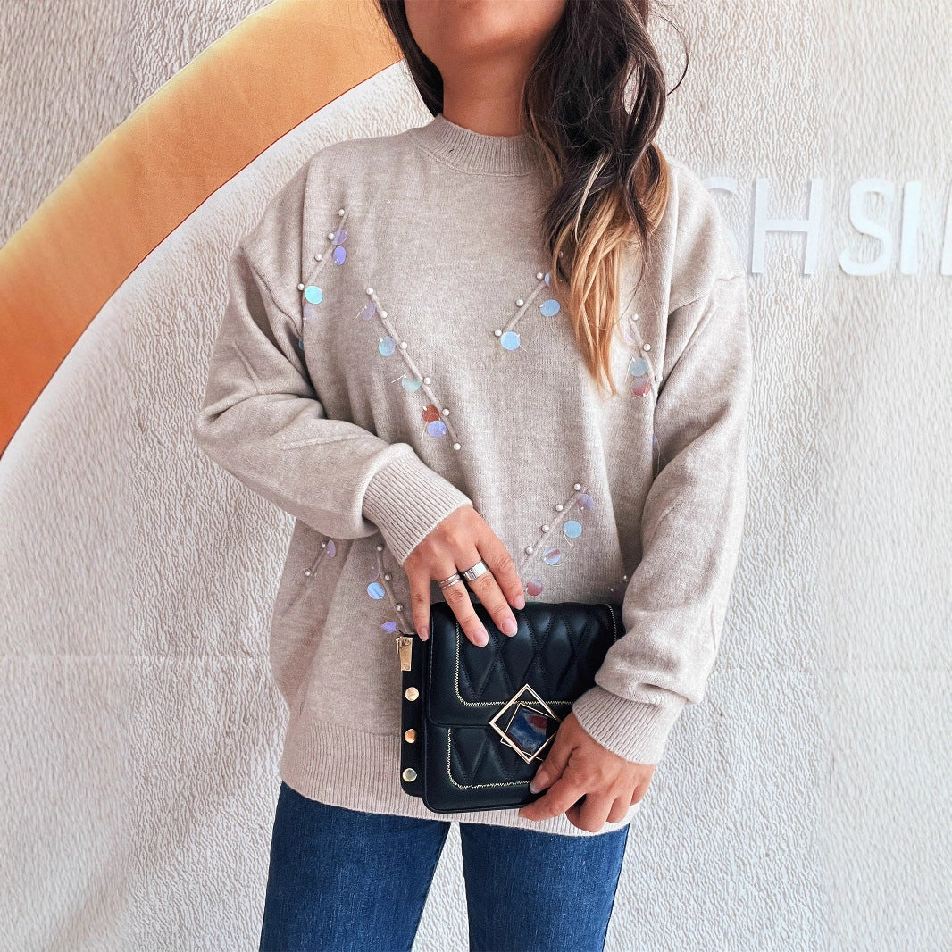 Pull femme avec des détails en perles et en strass à la mode Chic und Stil