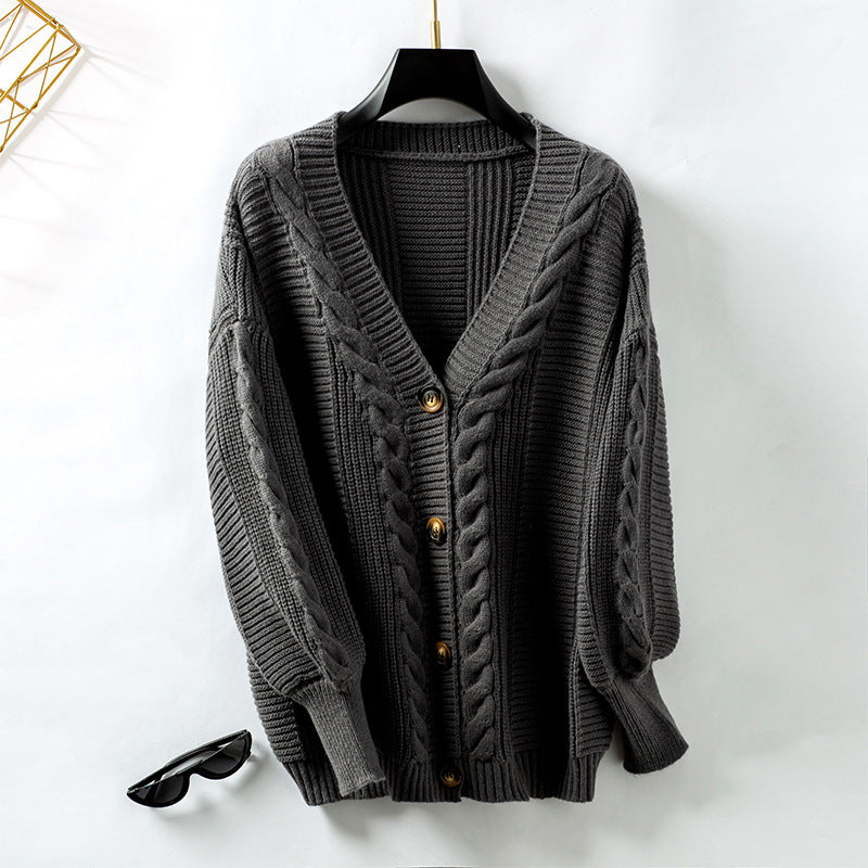 Veste en tricot pour femmes avec design en torsades et détails en boutons dorés Chic und Stil