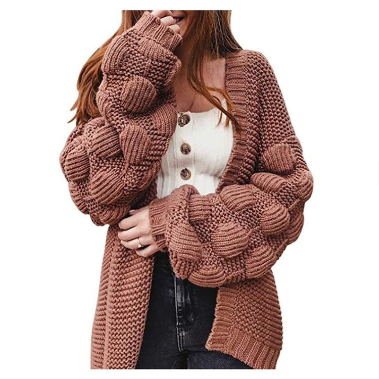 Veste en tricot pour femmes avec des manches bouffantes volumineuses et un aspect de maille structuré Chic und Stil
