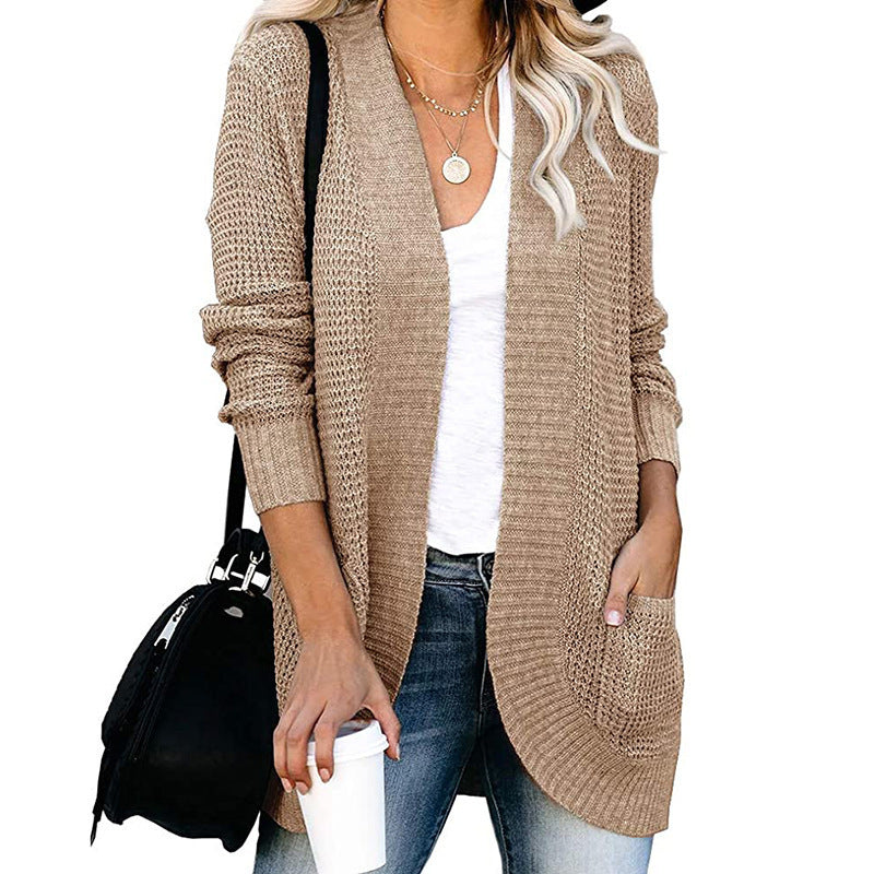 Veste en tricot pour femmes avec un motif de tricot moderne et des poches pratiques Chic und Stil