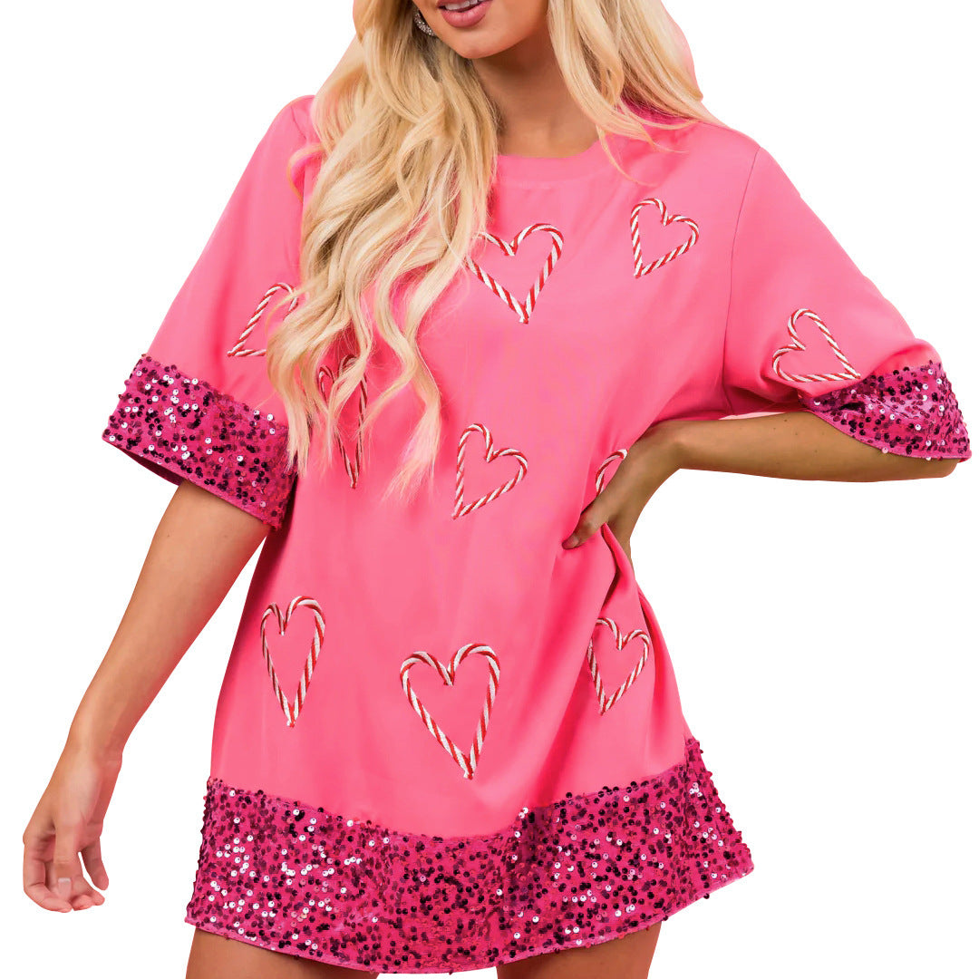 T-shirt de sport féminin avec un motif de cœur espiègle et des manches scintillantes Chic und Stil