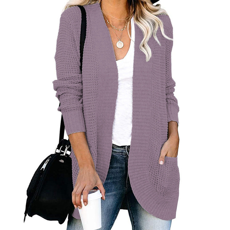 Veste en tricot pour femmes avec un motif de tricot moderne et des poches pratiques Chic und Stil