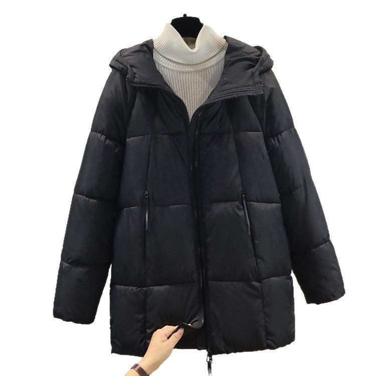 Women's comfortable and stylish puffer jacket with hood and practical zip pockets. Chic and stylish.