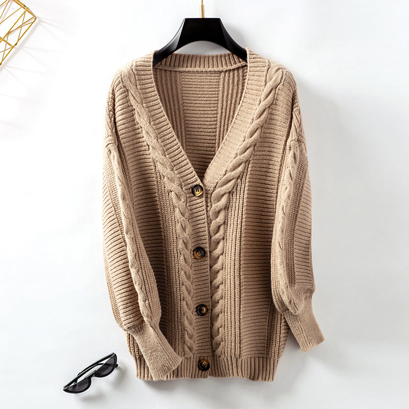 Veste en tricot pour femmes avec design en torsades et détails en boutons dorés Chic und Stil