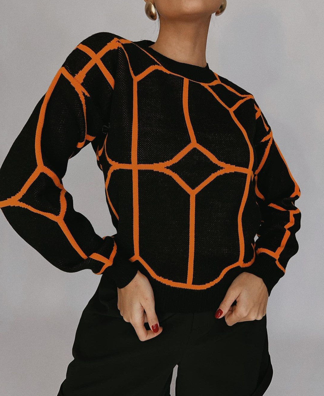 Pull en maille tendance pour femmes avec un design géométrique accrocheur Chic und Stil