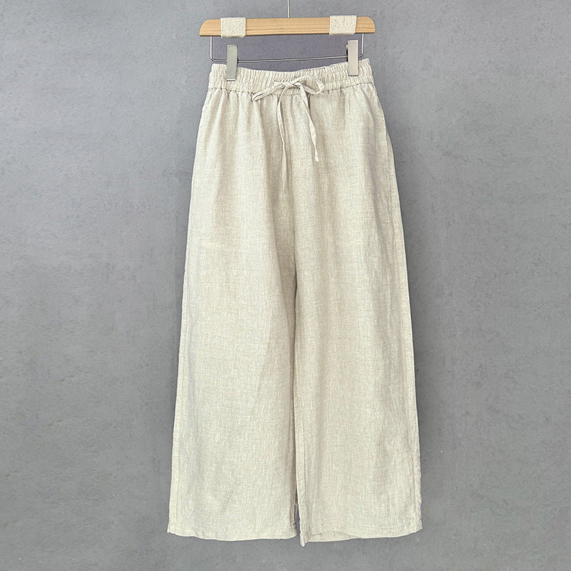 Casual linen pants for women with elastic waist and side pockets with openings.