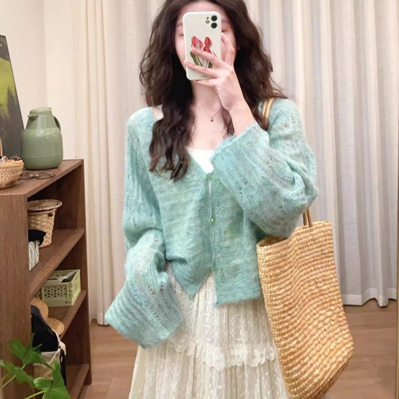 Cardigan en tricot léger pour femmes avec une fine structure en mailles ajourées et une coupe ample Chic und Stil
