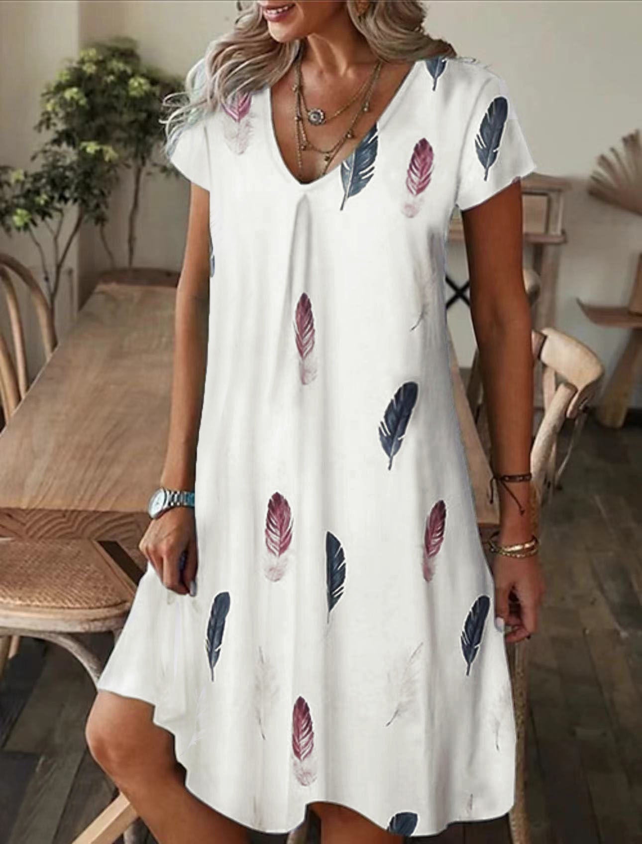 Robe midi à décolleté en V fluide pour femmes avec motif abstrait Chic und Stil