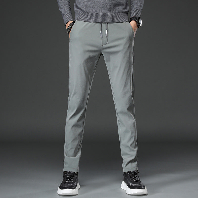 Men's slim fit sports pants with elastic waistband and practical zip pockets Chic and Style