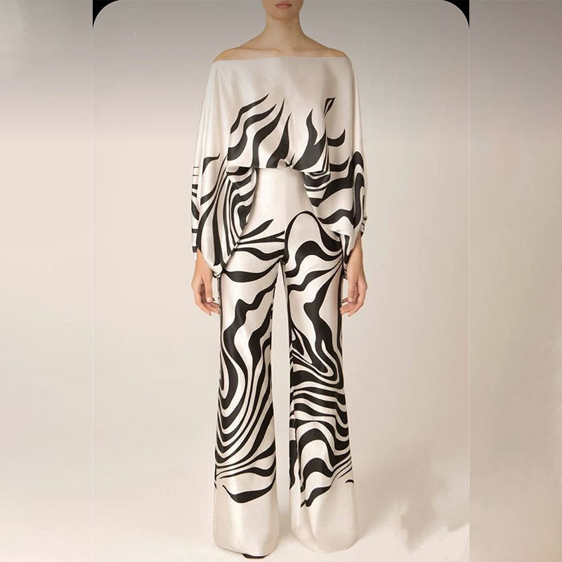 Dames combinaison élégante avec coupe asymétrique et motif accrocheur Chic und Stil