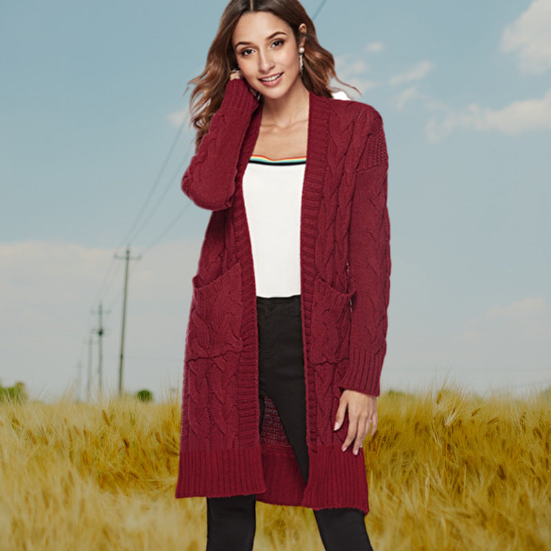 Cardigan en gros tricot pour femmes avec un élégant design en torsade et des poches pratiques Chic und Stil