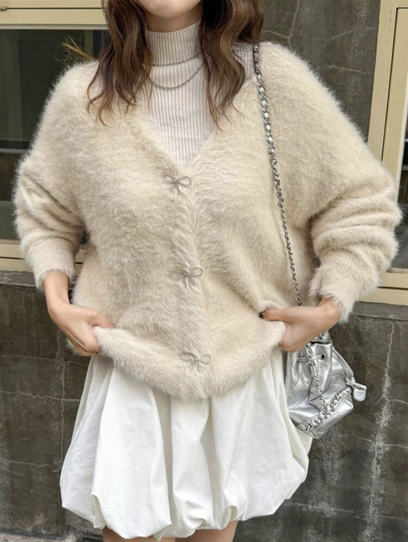Dames Pull en maille pelucheux avec des détails de boutons élégants Chic und Stil