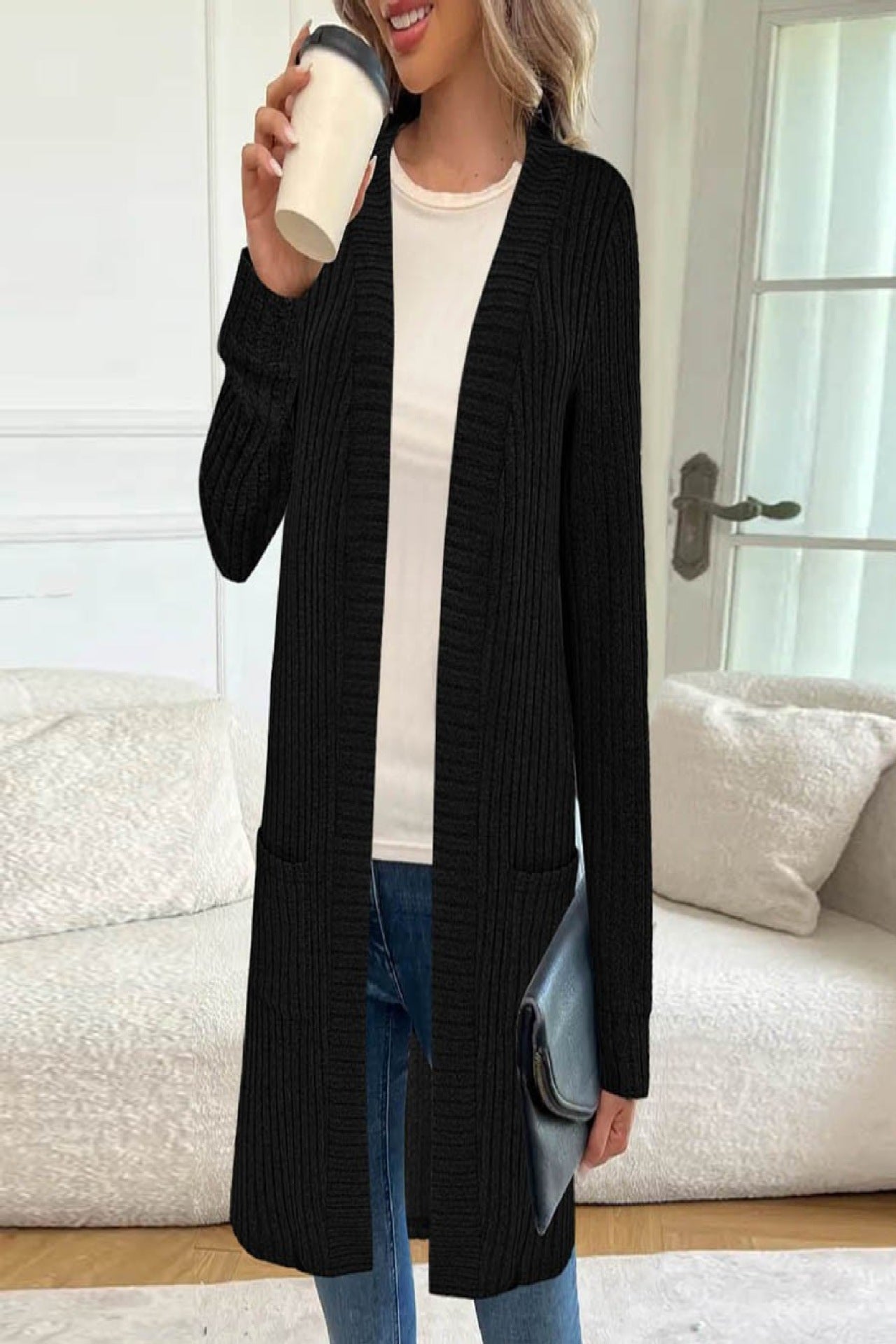 Veste tricotée longue pour femmes avec poches latérales et design texturé Chic und Stil