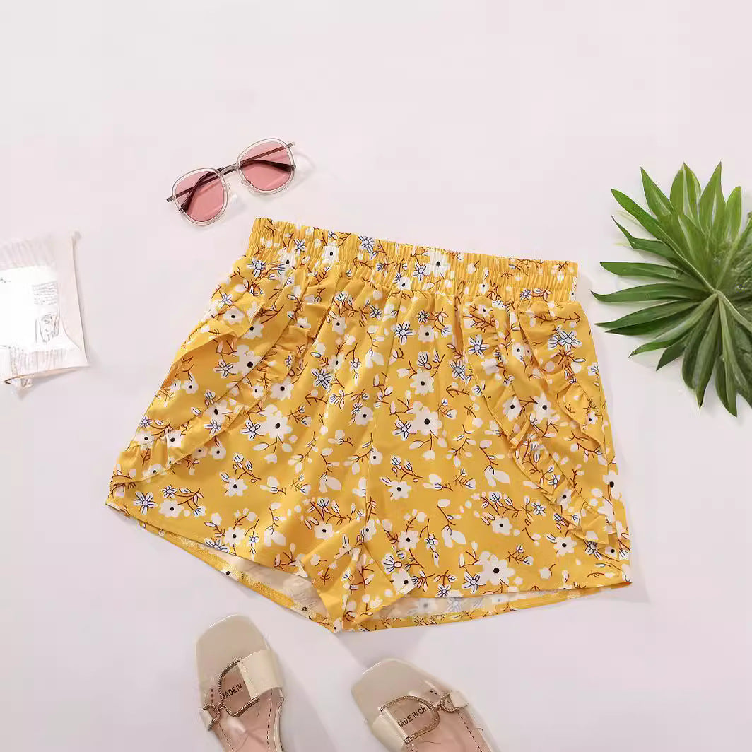 Shorts fleuris pour femmes avec taille élastique et poches latérales Chic und Stil