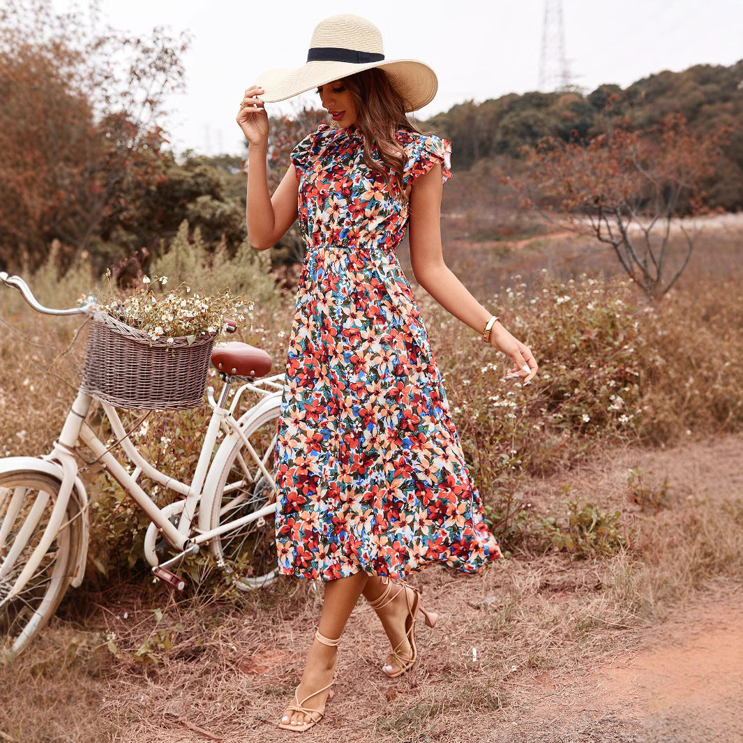 Robe maxi femme avec un imprimé floral joyeux et des détails volantés Chic und Stil