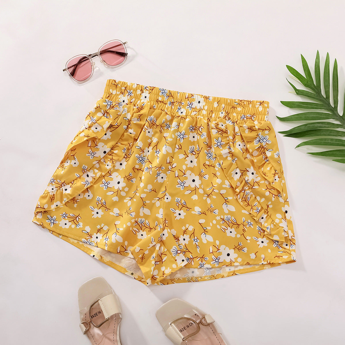 Shorts fleuris pour femmes avec taille élastique et poches latérales Chic und Stil