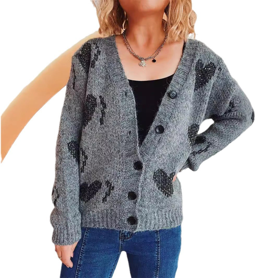 Cardigan en tricot pour femmes avec motif en forme de cœur et détails de boutons Chic und Stil