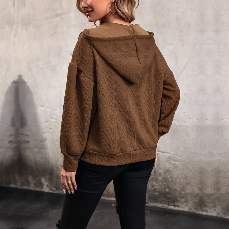 Pull femme avec capuche et design texturé Chic und Stil