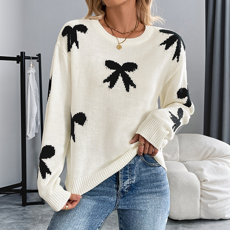 Dames Pull doux avec un motif nœud ludique Chic und Stil