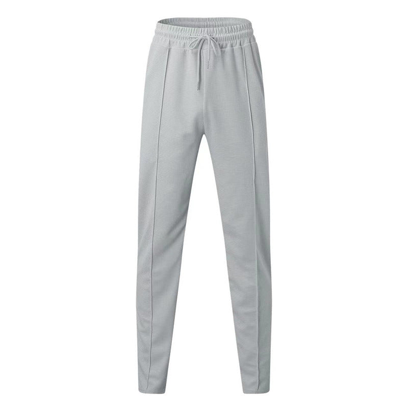 Pantalon de jogging sportif pour hommes avec taille élastique et poches zippées Chic und Stil