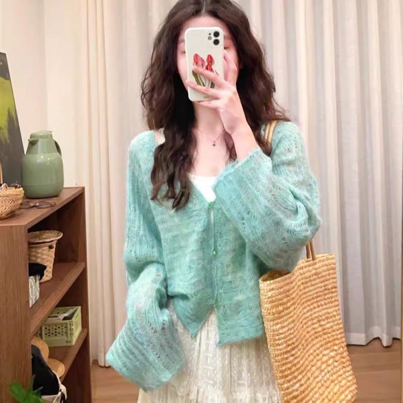 Cardigan en tricot léger pour femmes avec une fine structure en mailles ajourées et une coupe ample Chic und Stil
