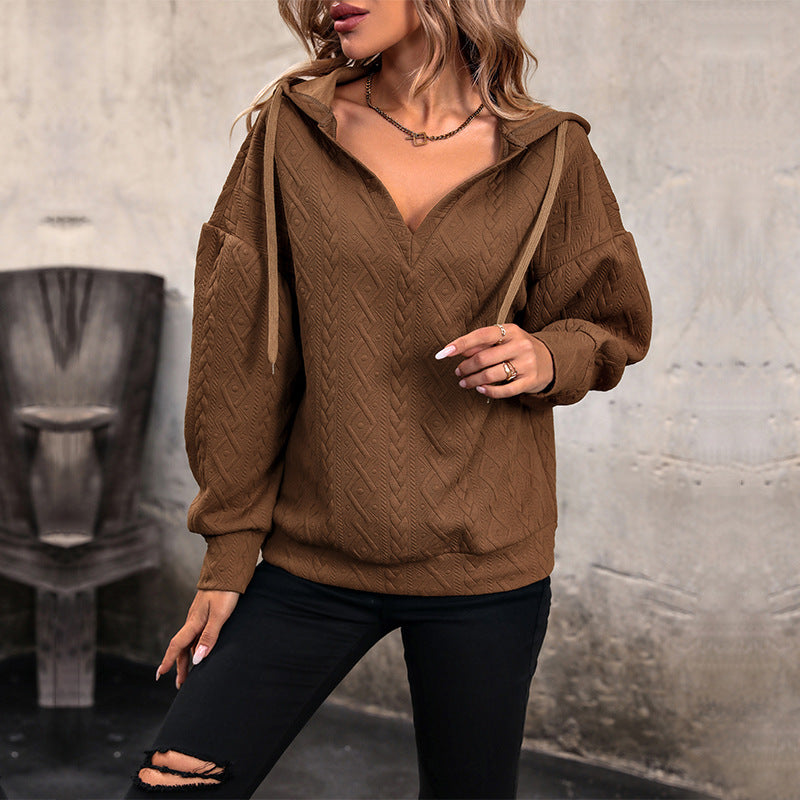 Pull femme avec capuche et design texturé Chic und Stil