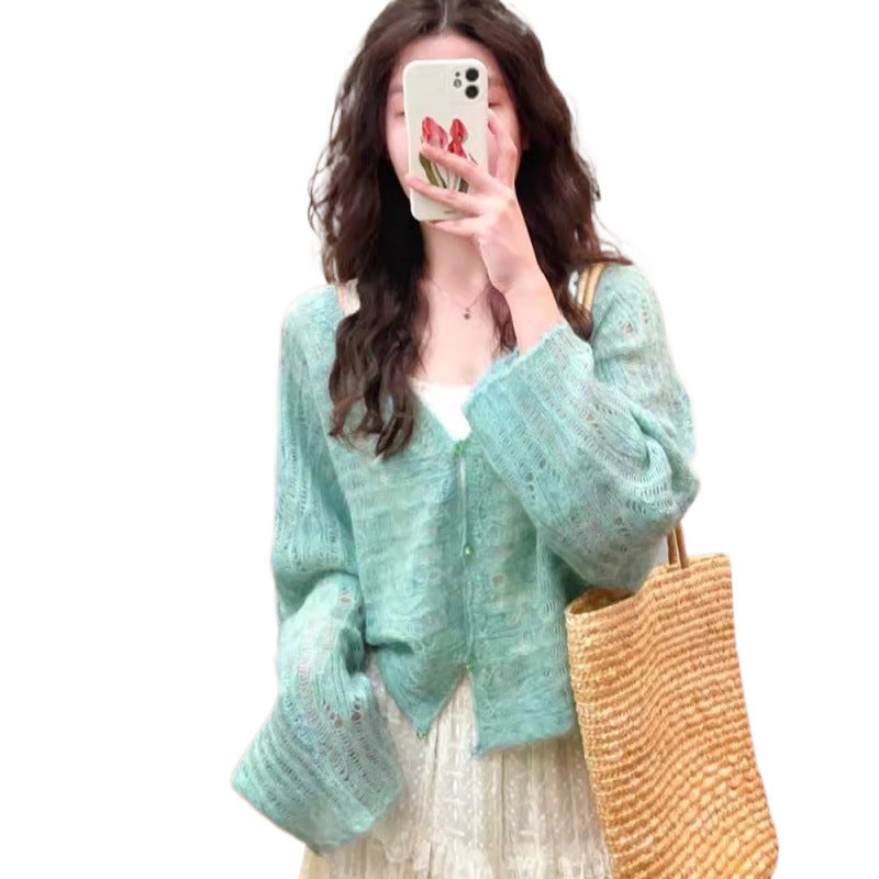 Cardigan en tricot léger pour femmes avec une fine structure en mailles ajourées et une coupe ample Chic und Stil