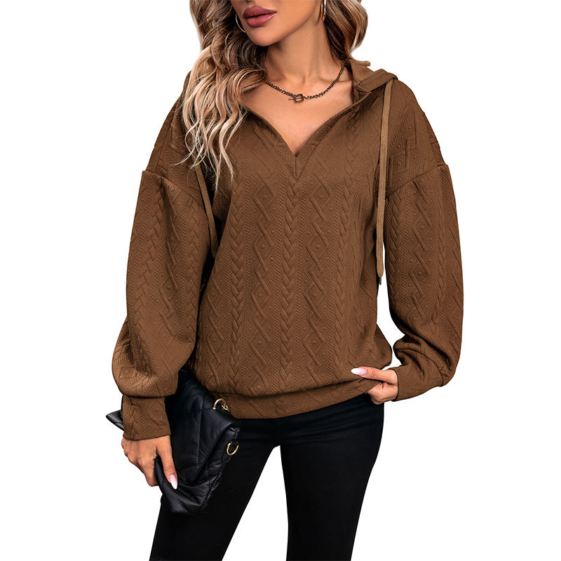Pull femme avec capuche et design texturé Chic und Stil