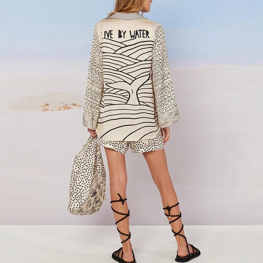 Chemisier de plage décontracté pour femmes avec un imprimé maritime artistique et un élégant décolleté en V Chic und Stil