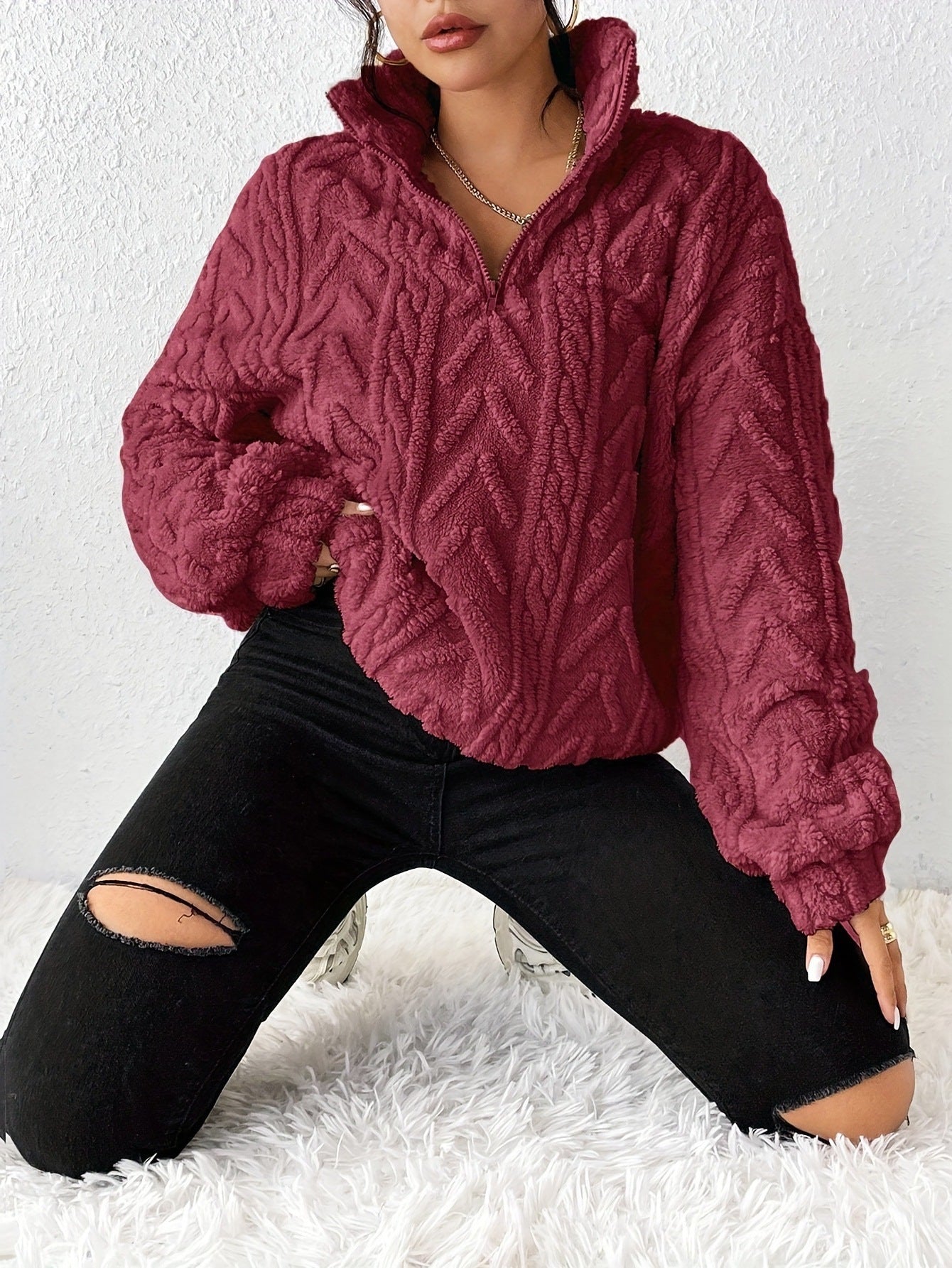 Pull femme en polaire avec col haut et design structuré Chic und Stil