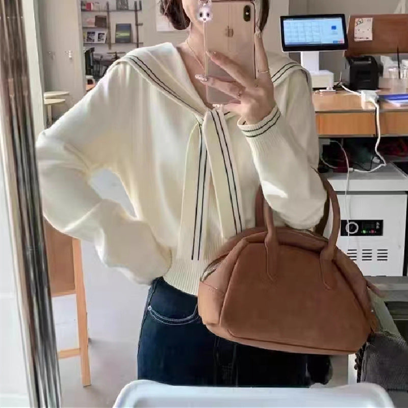 Pull femme élégant avec col à nœud et fine structure en tricot Chic und Stil