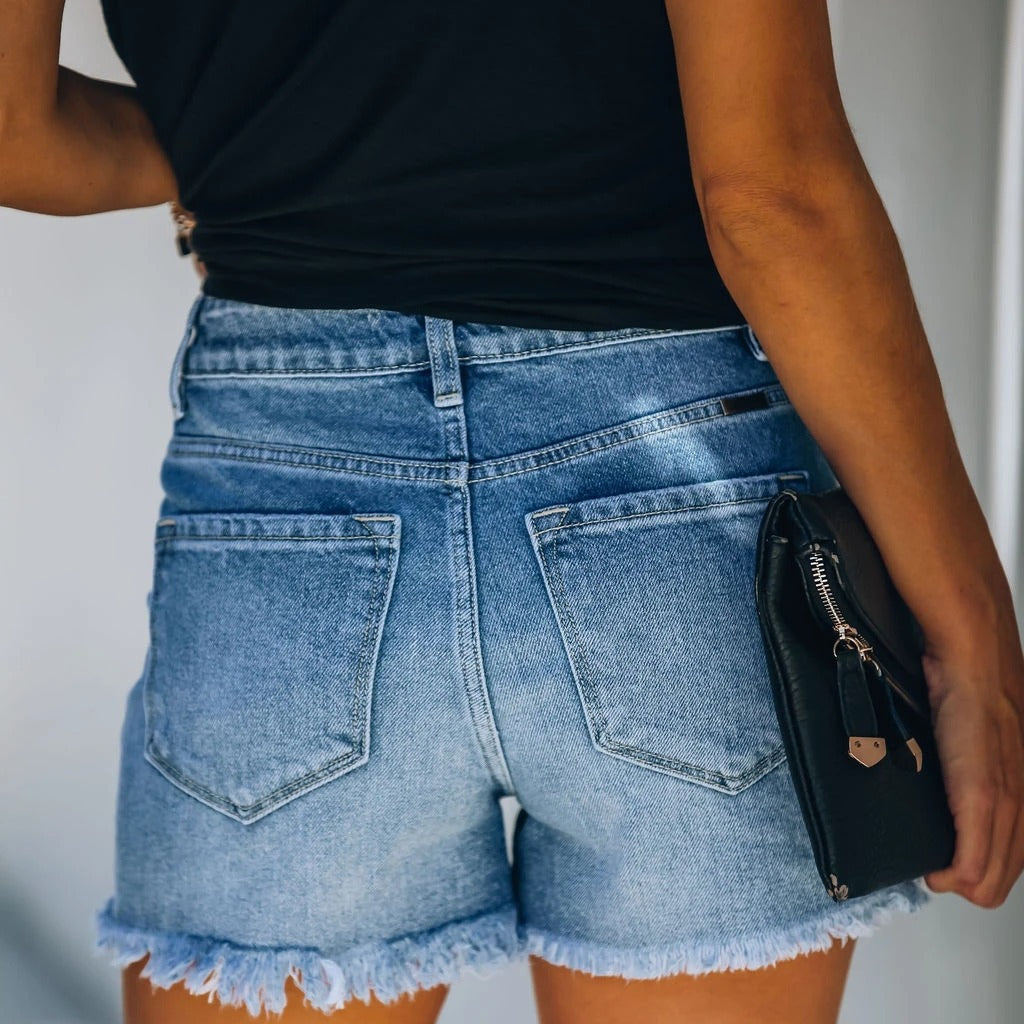 Women's denim shorts in a casual destroyed look with high waist and frayed hem Chic und Stil