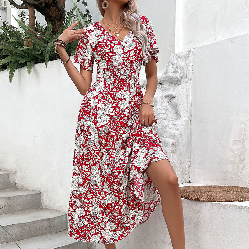 Robe midi à imprimé floral pour femmes avec décolleté en V et manches courtes flottantes Chic und Stil