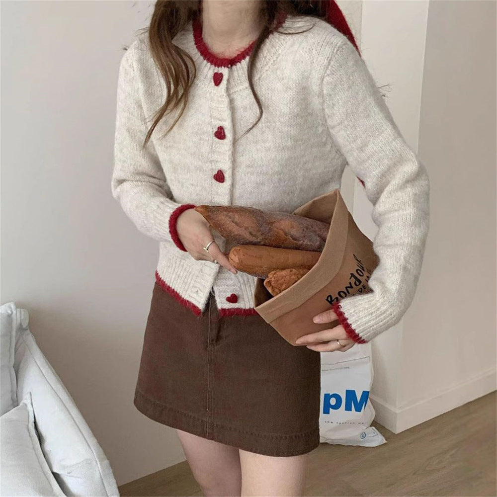 Dames gilet en tricot douillet avec boutons en forme de cœur et conception de manches raffinée Chic und Stil