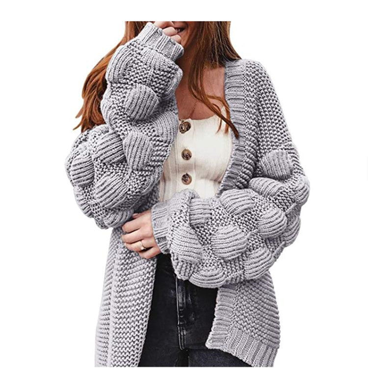Veste en tricot pour femmes avec des manches bouffantes volumineuses et un aspect de maille structuré Chic und Stil