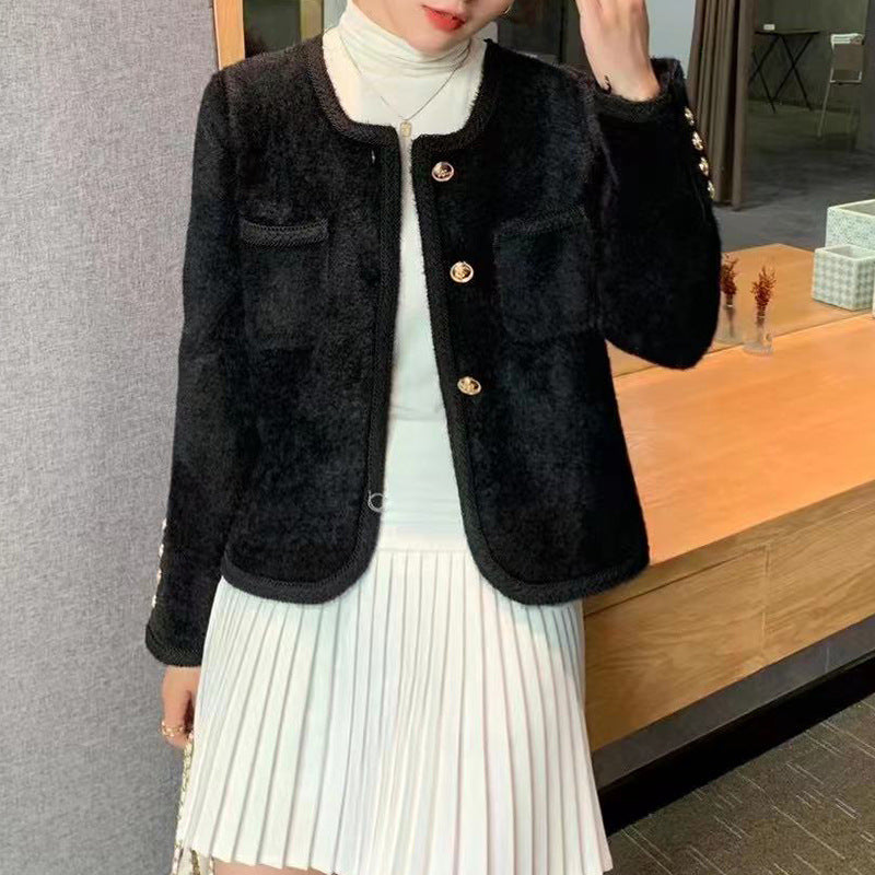 Elegant ladies' cardigan with gold buttons and fine texture. Chic and stylish.