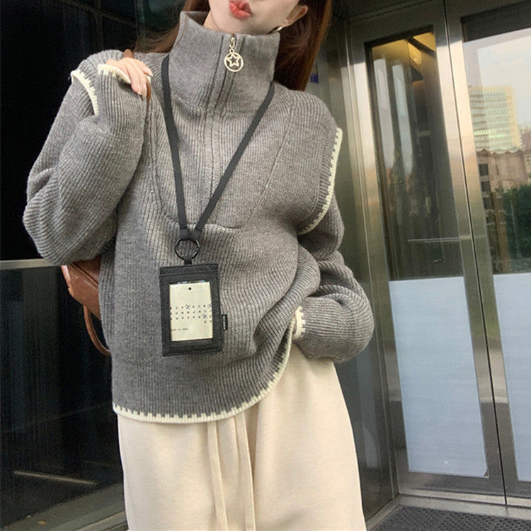Pull femme tendance avec col montant et finitions de manches spéciales Chic und Stil