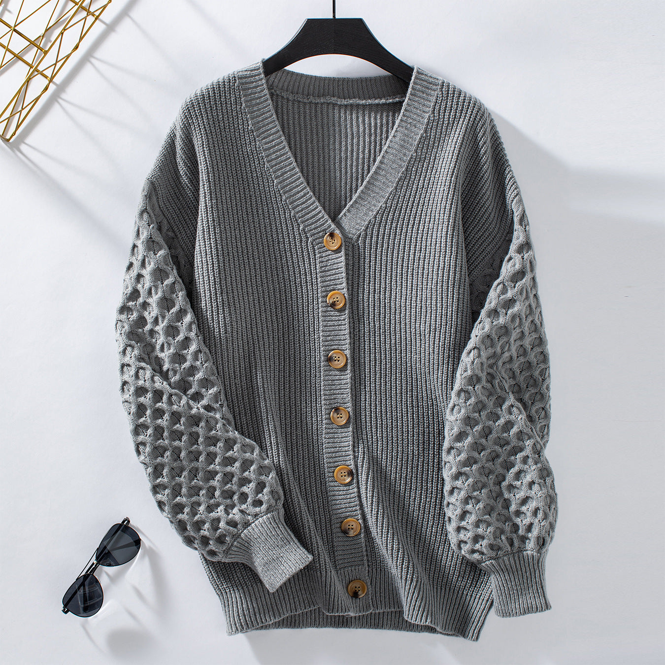 Veste en tricot pour femmes avec des manches texturées et des détails de boutons Chic und Stil