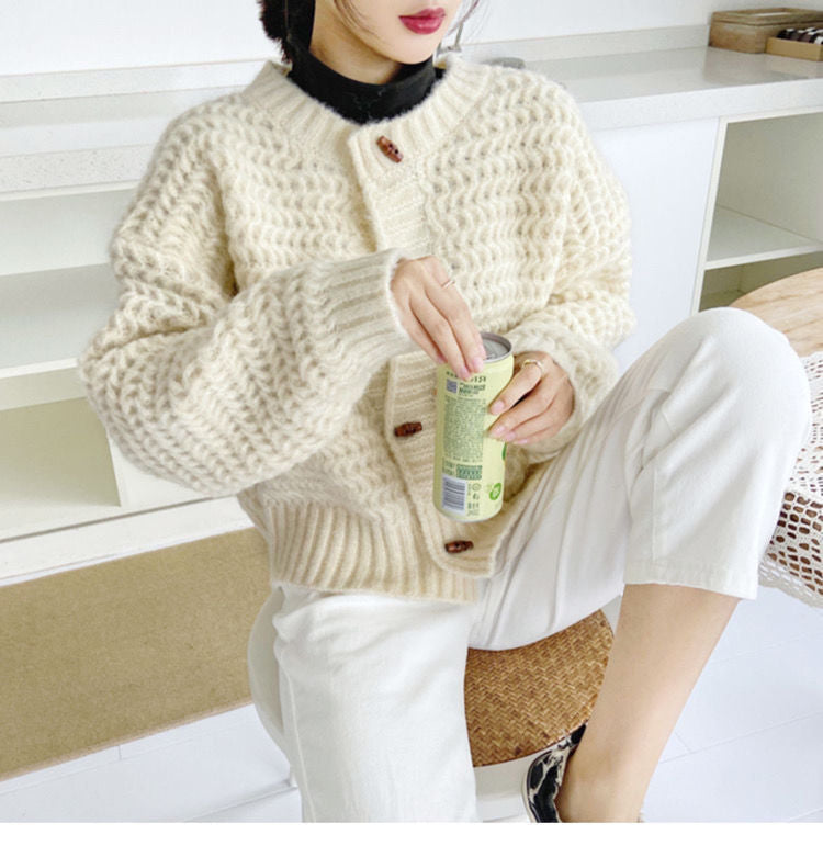 Pull en gros tricot pour femmes avec patte de boutonnage décorative et motif en nid d'abeille Chic und Stil