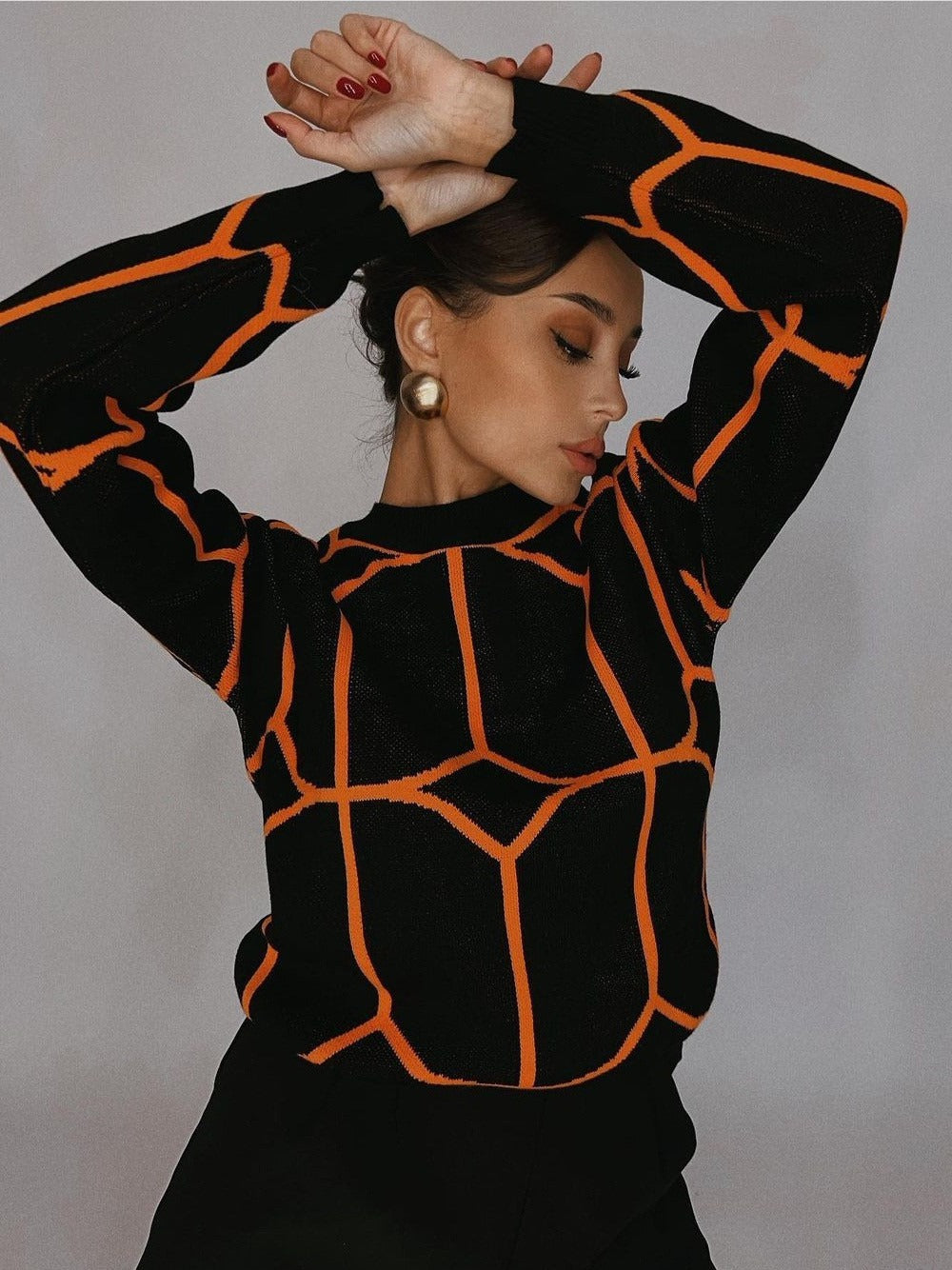 Pull en maille tendance pour femmes avec un design géométrique accrocheur Chic und Stil