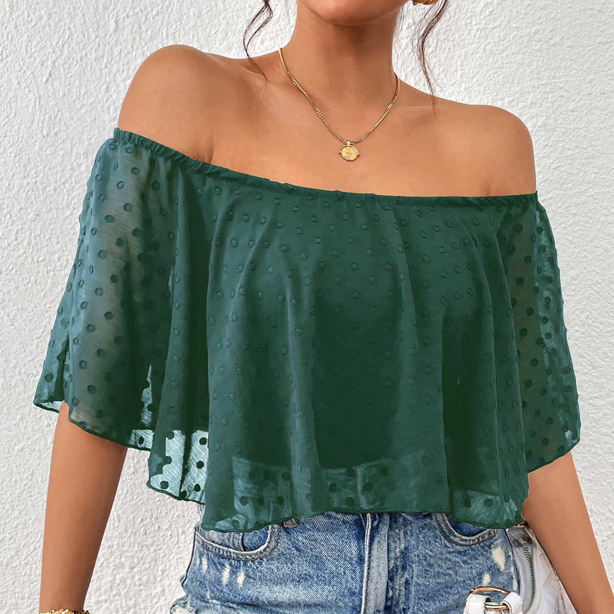 Haut féminin à épaules nues avec des points transparents Chic und Stil