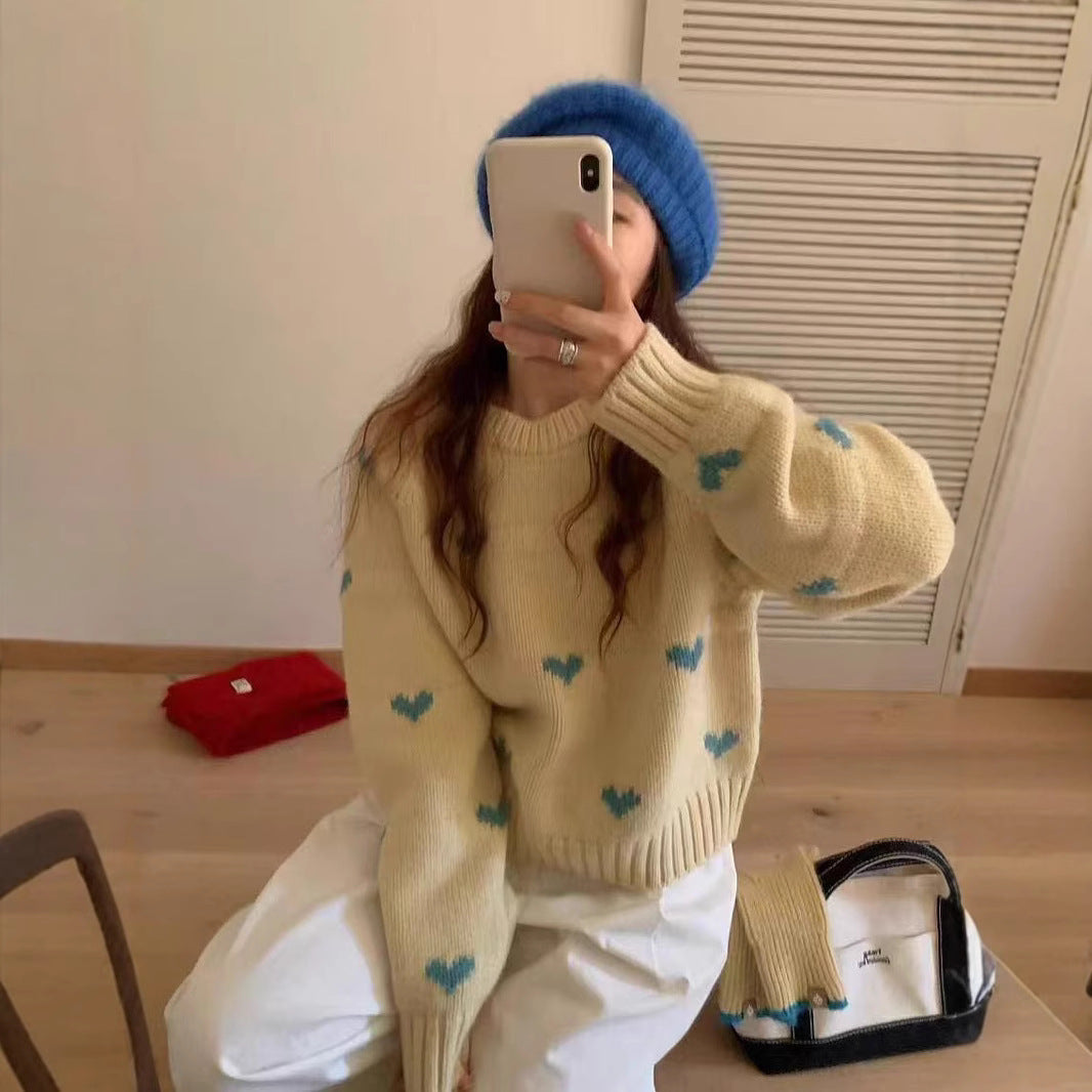 Femmes pull tricoté avec motif cœur et large bande Chic und Stil