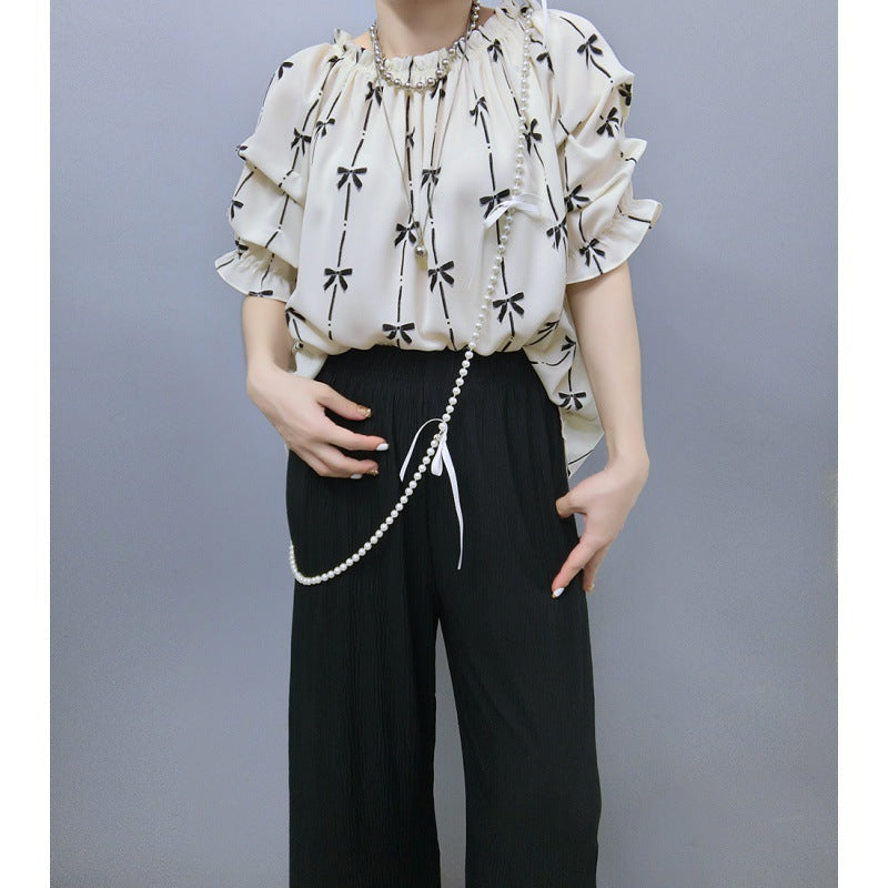 Blouse pour femmes avec des manches à volants et motif de nœuds Chic und Stil