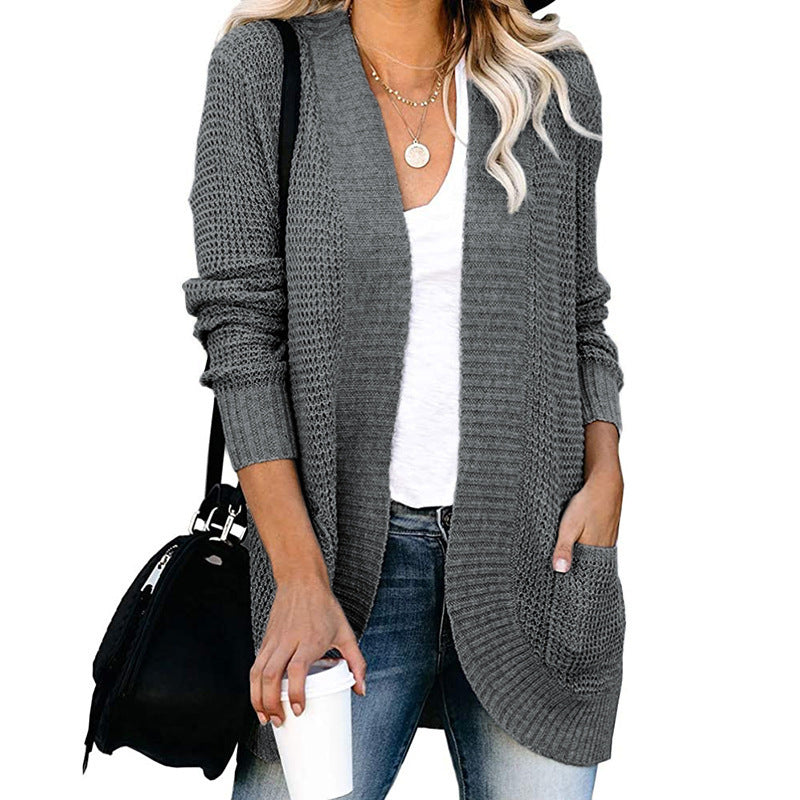 Veste en tricot pour femmes avec un motif de tricot moderne et des poches pratiques Chic und Stil