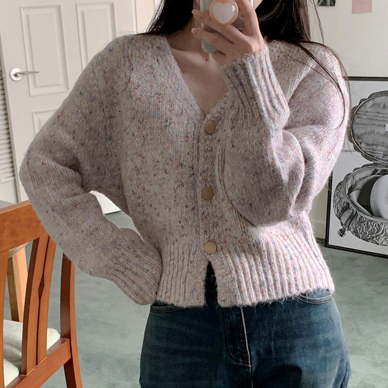 Soft knit cardigan for ladies with a modern V-neck and large button details Chic und Stil