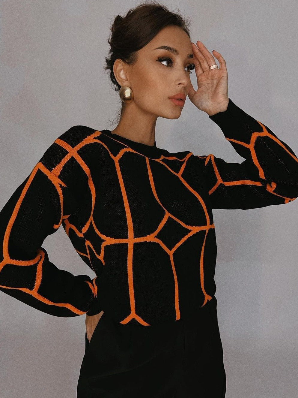 Pull en maille tendance pour femmes avec un design géométrique accrocheur Chic und Stil