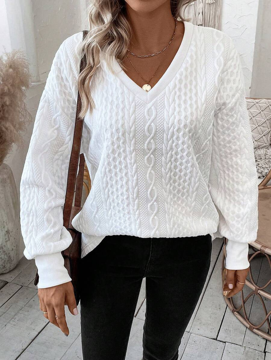 Pull en tricot pour femmes avec un profond décolleté en V et un motif texturé Chic und Stil